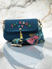 A Floral Dream: Crocheted Blue Handbag with Personalized Touch