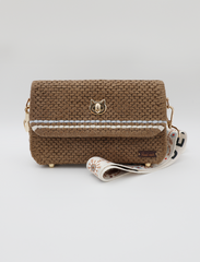 A Cat’s Meow: A Chic Handbag with a Metallic Feline Emblem